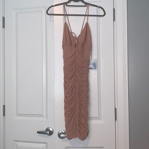 Never worn revolve dress. Size M. Stretchy material.